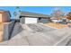 Modern house exterior with white garage door and dark gray paint at 5124 Brownwood Ave, Las Vegas, NV 89122