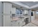 Well-equipped kitchen, featuring white cabinets and a double sink at 5124 Brownwood Ave, Las Vegas, NV 89122