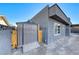 Gray metal storage shed with ramp access in backyard at 5124 Brownwood Ave, Las Vegas, NV 89122