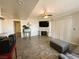 Spacious living room with fireplace and sliding glass doors at 5320 Duralite St # 102, Las Vegas, NV 89122