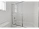 Clean bathroom with a shower/tub and tiled walls at 5400 Flowing Spring St, Las Vegas, NV 89122