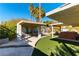 Backyard with pergola, hot tub, and artificial turf at 57 Marion Dr, Las Vegas, NV 89110