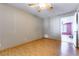 Laminate floors and ceiling fan in this simple bedroom at 57 Marion Dr, Las Vegas, NV 89110