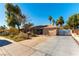 Single story home with large driveway and gated side yard at 57 Marion Dr, Las Vegas, NV 89110