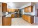 Kitchen boasts stainless steel appliances and wood cabinets at 57 Marion Dr, Las Vegas, NV 89110