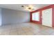 Spacious living room with tile floors and ceiling fan at 57 Marion Dr, Las Vegas, NV 89110