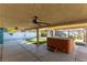 Covered patio with hot tub and ceiling fan at 57 Marion Dr, Las Vegas, NV 89110