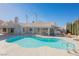 Inviting kidney-shaped pool with lounge chairs at 5904 Willowcreek Rd, North Las Vegas, NV 89031