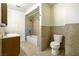 Clean bathroom with shower/tub combo and wood vanity at 6229 Cromwell Ave, Las Vegas, NV 89107