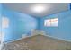 Unfinished bedroom with light blue walls and flooring at 6229 Cromwell Ave, Las Vegas, NV 89107