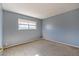 Simple bedroom with light grey walls and carpeted floor at 6229 Cromwell Ave, Las Vegas, NV 89107