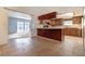 Kitchen with wood cabinets and breakfast bar at 6229 Cromwell Ave, Las Vegas, NV 89107