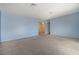 Living room with light blue walls and carpet at 6229 Cromwell Ave, Las Vegas, NV 89107