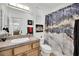 Bathroom with wood cabinets and a marble-look shower curtain at 624 Via Colmo Ave, Henderson, NV 89011