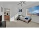 Bright bedroom with large window, ensuite bathroom access, and plush carpeting at 624 Via Colmo Ave, Henderson, NV 89011