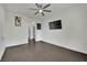 Bright bedroom featuring dark wood floors and ceiling fan at 624 Via Colmo Ave, Henderson, NV 89011