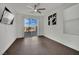 Bedroom with dark wood flooring and access to a patio at 624 Via Colmo Ave, Henderson, NV 89011