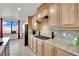 Modern kitchen with granite countertops and stainless steel appliances at 624 Via Colmo Ave, Henderson, NV 89011