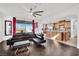 Open concept living room and kitchen with dark hardwood floors at 624 Via Colmo Ave, Henderson, NV 89011