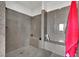 Large walk-in shower with granite tile and built-in seat at 624 Via Colmo Ave, Henderson, NV 89011