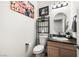 Small bathroom with granite countertop and updated fixtures at 6436 Emerson St, Pahrump, NV 89048