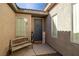 Small front courtyard with a bench and welcoming sign at 6436 Emerson St, Pahrump, NV 89048