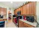 Well-equipped kitchen with wood cabinets and granite countertops at 6436 Emerson St, Pahrump, NV 89048