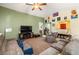 Bright living room with ample seating and decorative wall art at 6436 Emerson St, Pahrump, NV 89048