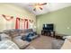 Spacious living room featuring a large sectional sofa and flat-screen TV at 6436 Emerson St, Pahrump, NV 89048