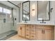 Spa-like bathroom with double vanity and glass shower at 7812 Desert Candle Way, Las Vegas, NV 89128