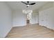 Bright and spacious bedroom with wood-look floors and an ensuite bathroom at 7812 Desert Candle Way, Las Vegas, NV 89128