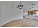 Bright dining area with chandelier and kitchen access at 7812 Desert Candle Way, Las Vegas, NV 89128