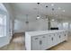 Modern kitchen with white shaker cabinets and quartz countertops at 7812 Desert Candle Way, Las Vegas, NV 89128