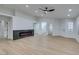 Spacious living room featuring a modern electric fireplace and light flooring at 7812 Desert Candle Way, Las Vegas, NV 89128