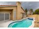 Inviting kidney-shaped pool with spa and patio at 7812 Desert Candle Way, Las Vegas, NV 89128