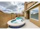 Relaxing backyard with a kidney-shaped pool and a hot tub at 7812 Desert Candle Way, Las Vegas, NV 89128