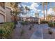 Landscaped community grounds with walkways and lush greenery at 7885 W Flamingo Rd # 1092, Las Vegas, NV 89147