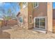 Small backyard with gravel and access from sliding door at 8322 Rygate Ave, Las Vegas, NV 89178