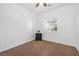 Light bedroom with ceiling fan, carpet, and nightstand at 8322 Rygate Ave, Las Vegas, NV 89178