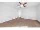 Spacious bedroom with ceiling fan and carpet flooring at 8322 Rygate Ave, Las Vegas, NV 89178