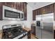 Stainless steel appliances and granite countertops in kitchen at 8322 Rygate Ave, Las Vegas, NV 89178