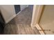 Bathroom showcasing luxury vinyl plank flooring adjacent to carpeted area and glass enclosed shower at 8416 Shore Breeze Dr, Las Vegas, NV 89128