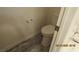 Cozy bathroom with tiled flooring and a toilet at 8416 Shore Breeze Dr, Las Vegas, NV 89128