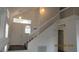 Inviting entryway boasting high ceilings, natural light, and a glimpse of the staircase at 8416 Shore Breeze Dr, Las Vegas, NV 89128