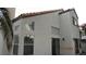 Exterior elevation of a stucco home with a red tile roof and desert landscaping at 8416 Shore Breeze Dr, Las Vegas, NV 89128