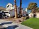 Two-story house with artificial turf and palm trees at 8416 Shore Breeze Dr, Las Vegas, NV 89128