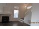 Bright foyer with stairs and a view of the front door and upper-level windows at 8416 Shore Breeze Dr, Las Vegas, NV 89128