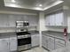 Updated kitchen, featuring stainless steel appliances and granite countertops at 8416 Shore Breeze Dr, Las Vegas, NV 89128