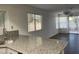 Kitchen view featuring granite countertops, ample natural light, and open floorplan at 8416 Shore Breeze Dr, Las Vegas, NV 89128