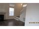 Well-lit living room showcasing a fireplace and open staircase at 8416 Shore Breeze Dr, Las Vegas, NV 89128